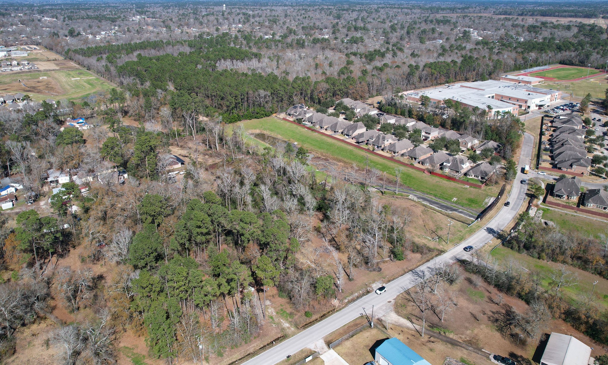 22475-22463 Adams Street Porter, TX 77365 - Photo 10 of 18 a view of a forest with a lake