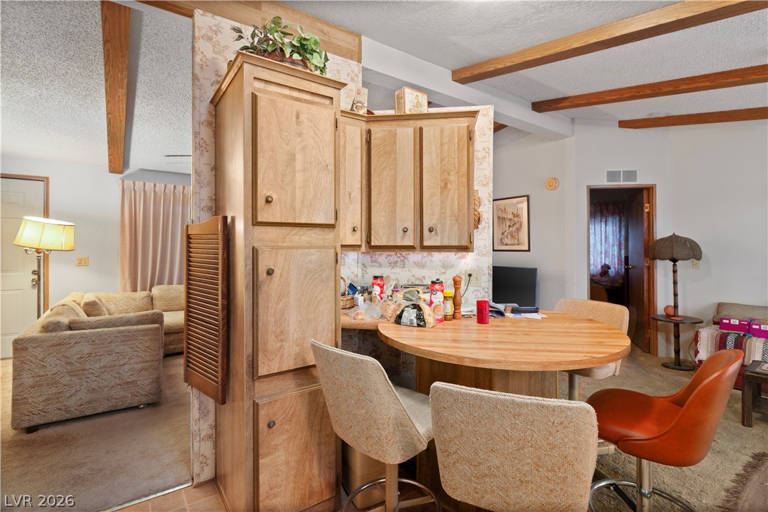 1609 Cajon Court Laughlin, NV 89029 - Photo 12 of 69 Dining room with beamed ceiling and a textured ceiling