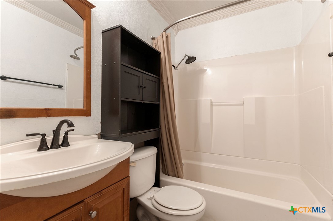 103 Cheaney Spur Killeen, TX 76543 - Photo 11 of 21 a bathroom with a sink toilet and shower
