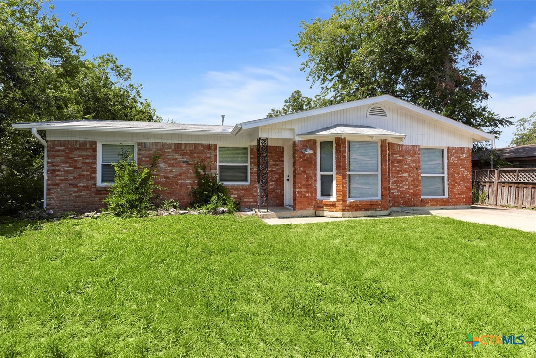 103 Cheaney Spur Killeen, TX 76543 - Photo 2 of 21 a front view of house with yard and green space