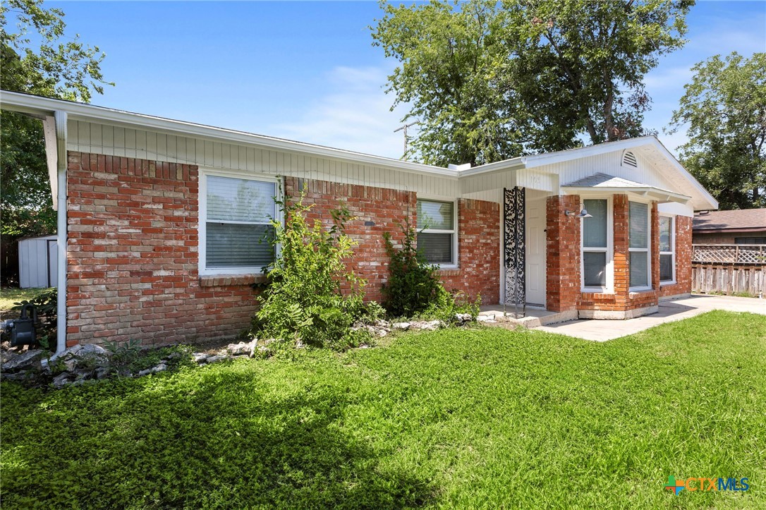103 Cheaney Spur Killeen, TX 76543 - Photo 3 of 21 a view of a house with a yard patio and a garden