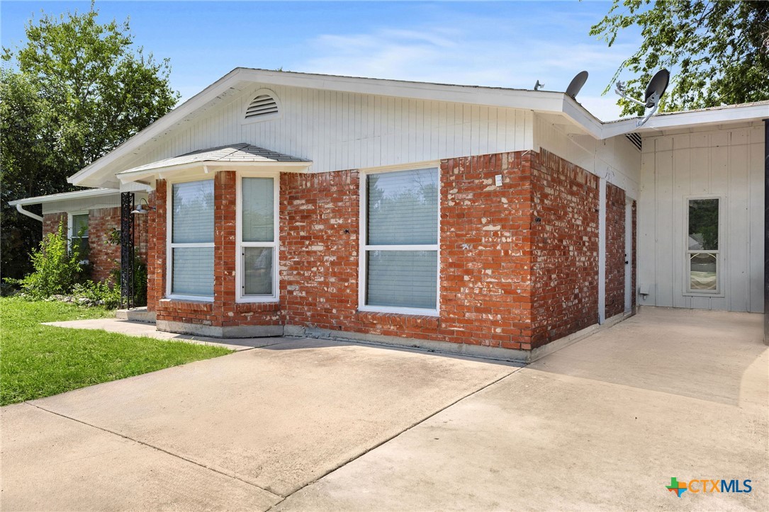 103 Cheaney Spur Killeen, TX 76543 - Photo 4 of 21 a front view of a house with a yard and garage