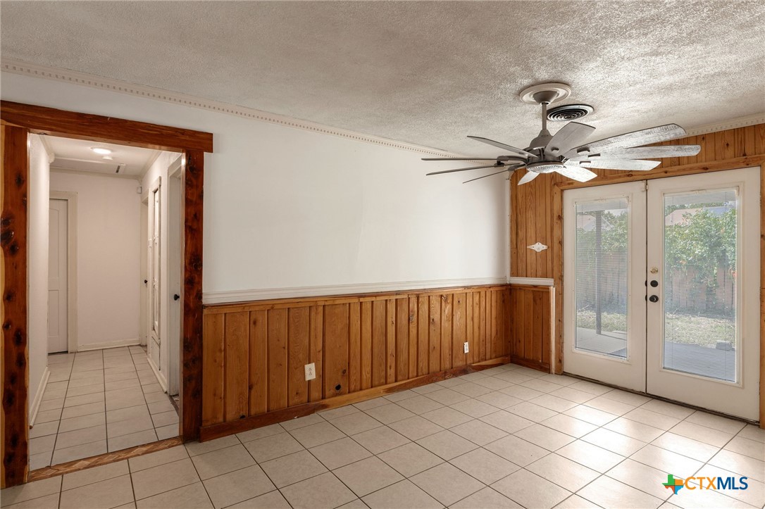 103 Cheaney Spur Killeen, TX 76543 - Photo 10 of 21 a view of a hallway with a chandelier fan and windows