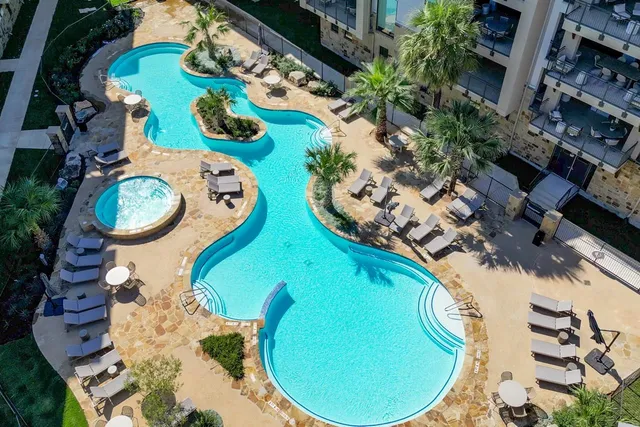 a view of a swimming pool with a patio