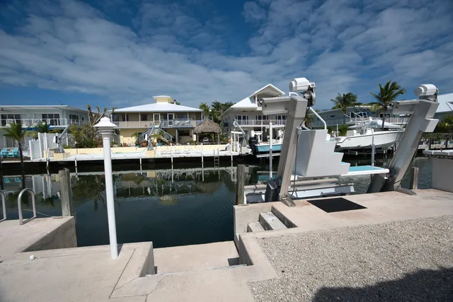 a yellow house with trees in front of it
