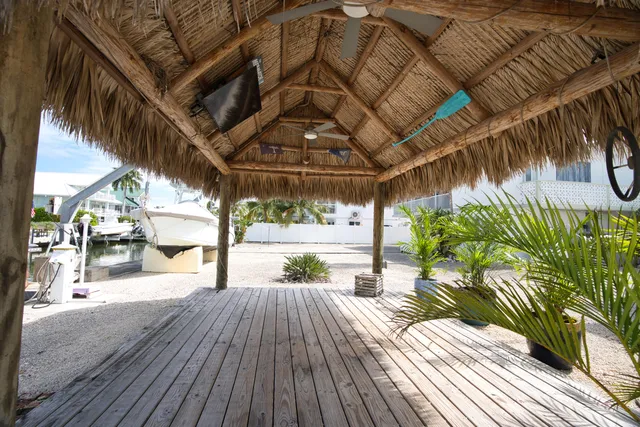 a view of a livingroom with furniture window and wooden floor