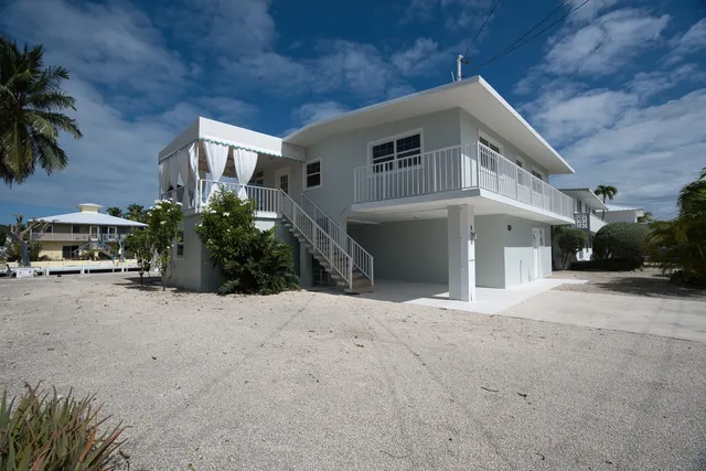 a view of a livingroom with furniture and a window