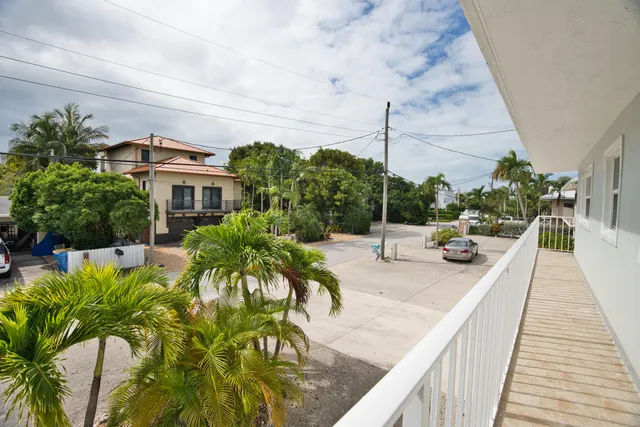 a view of a livingroom and a chandelier fan