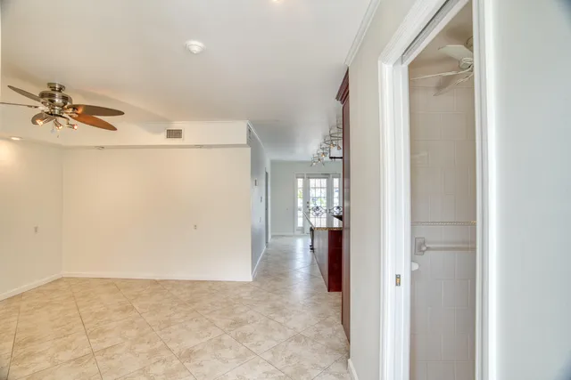 a kitchen with a sink window and stainless steel appliances