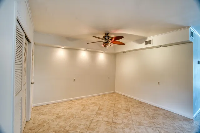 a view of a storage & utility room with fridge dryer and washer