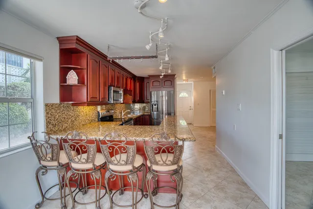 a view of a swimming pool with outdoor seating