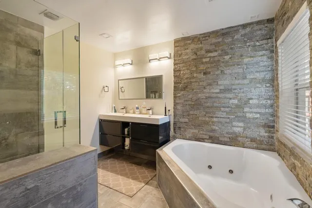 a bathroom with a bathtub and a sink
