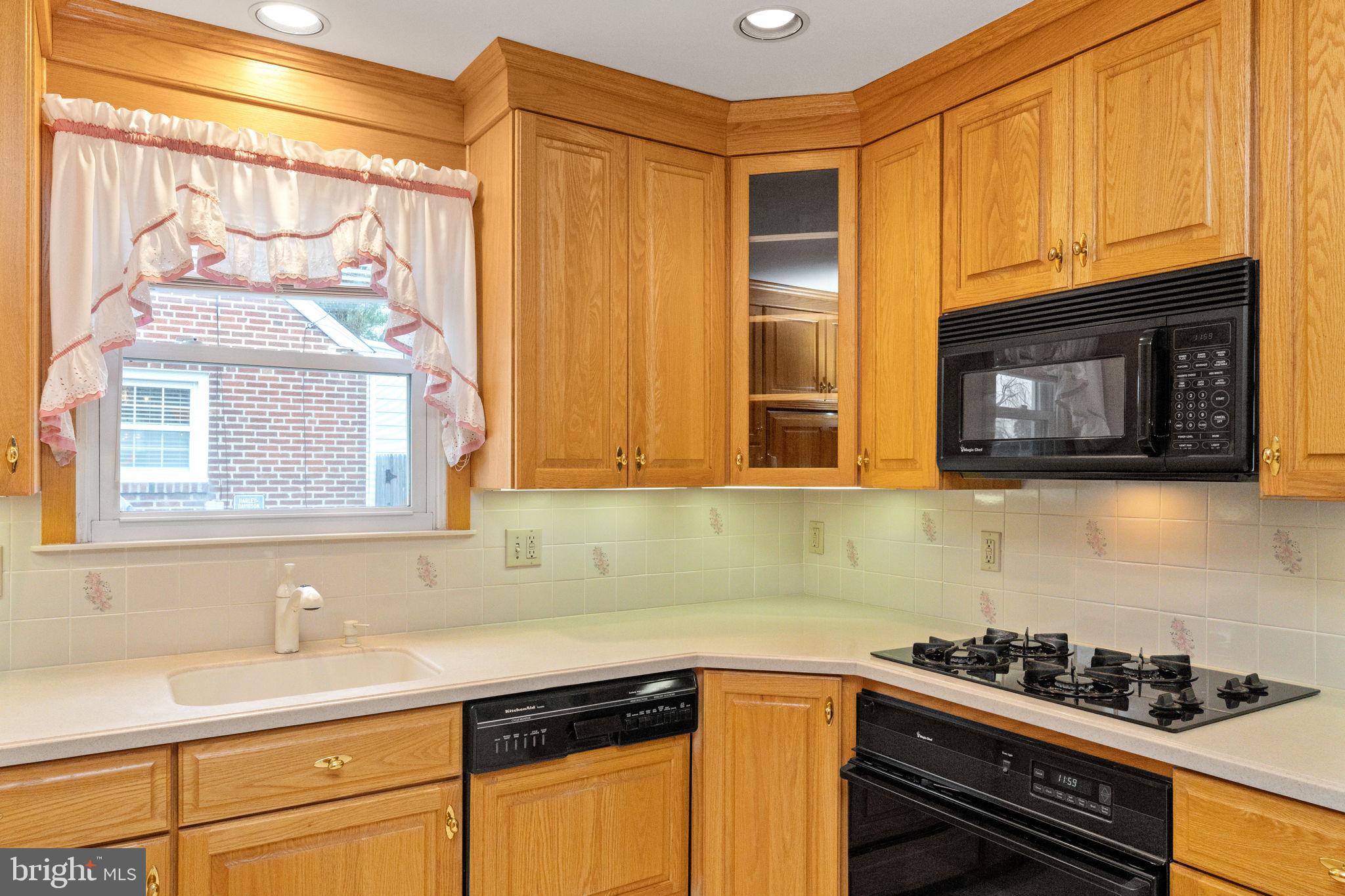 411 Buse Street Ridley Park, PA 19078 - Photo 12 of 30 a kitchen with stainless steel appliances a stove and a microwave