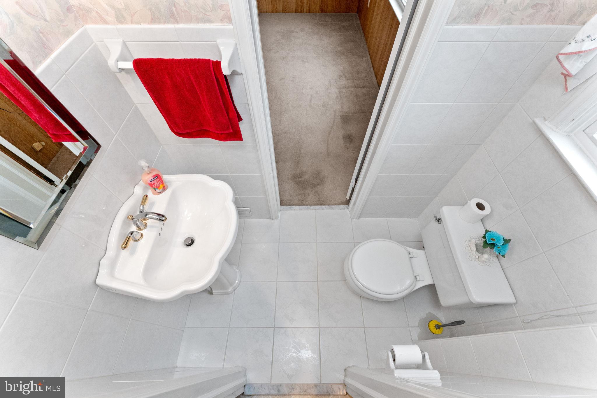 411 Buse Street Ridley Park, PA 19078 - Photo 15 of 30 a bathroom with a sink and a mirror