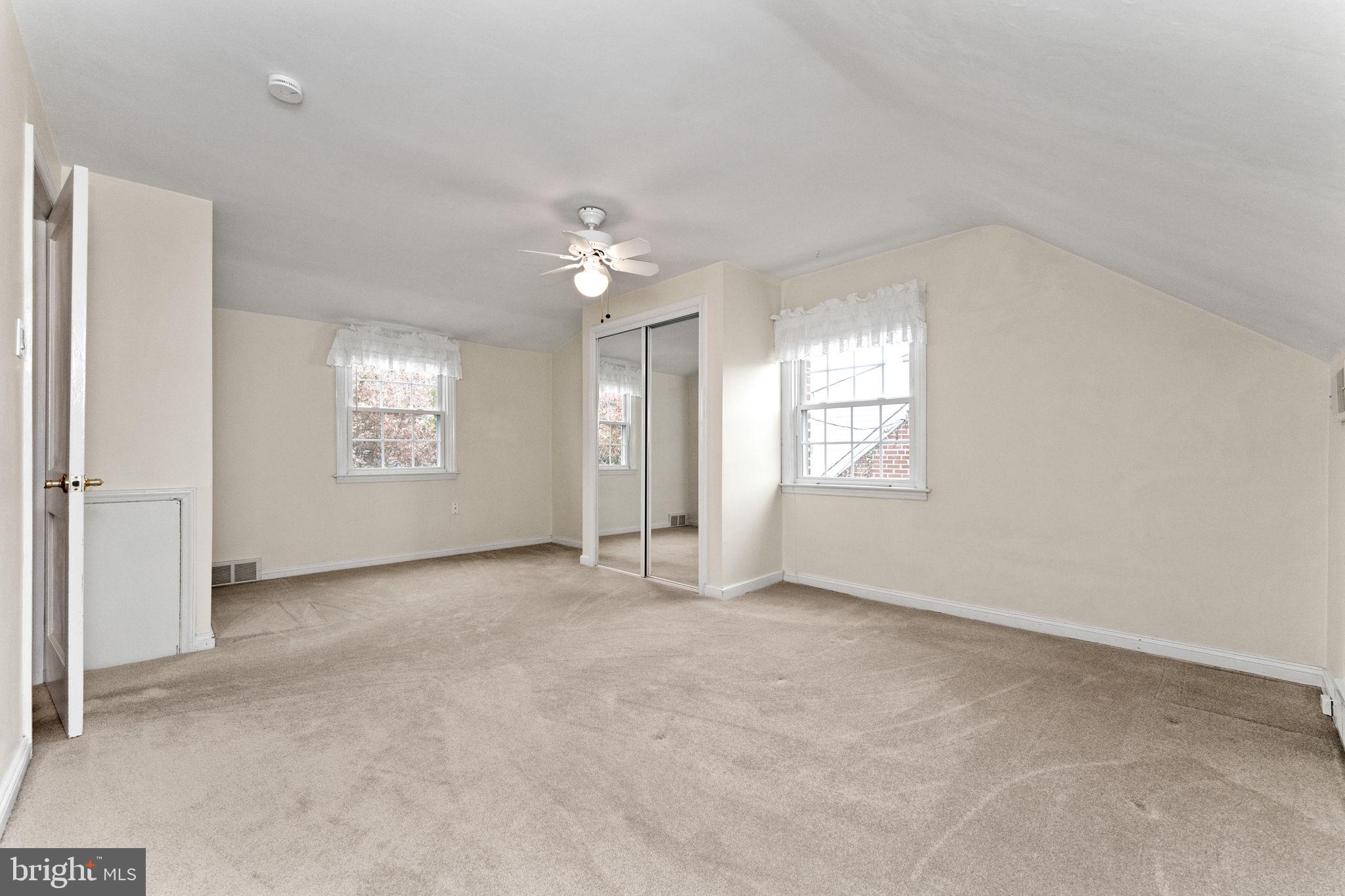 411 Buse Street Ridley Park, PA 19078 - Photo 18 of 30 an empty room with windows and closet