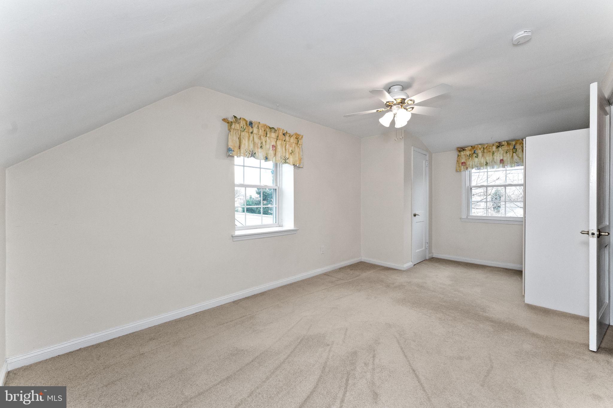 411 Buse Street Ridley Park, PA 19078 - Photo 20 of 30 an empty room with windows and fan