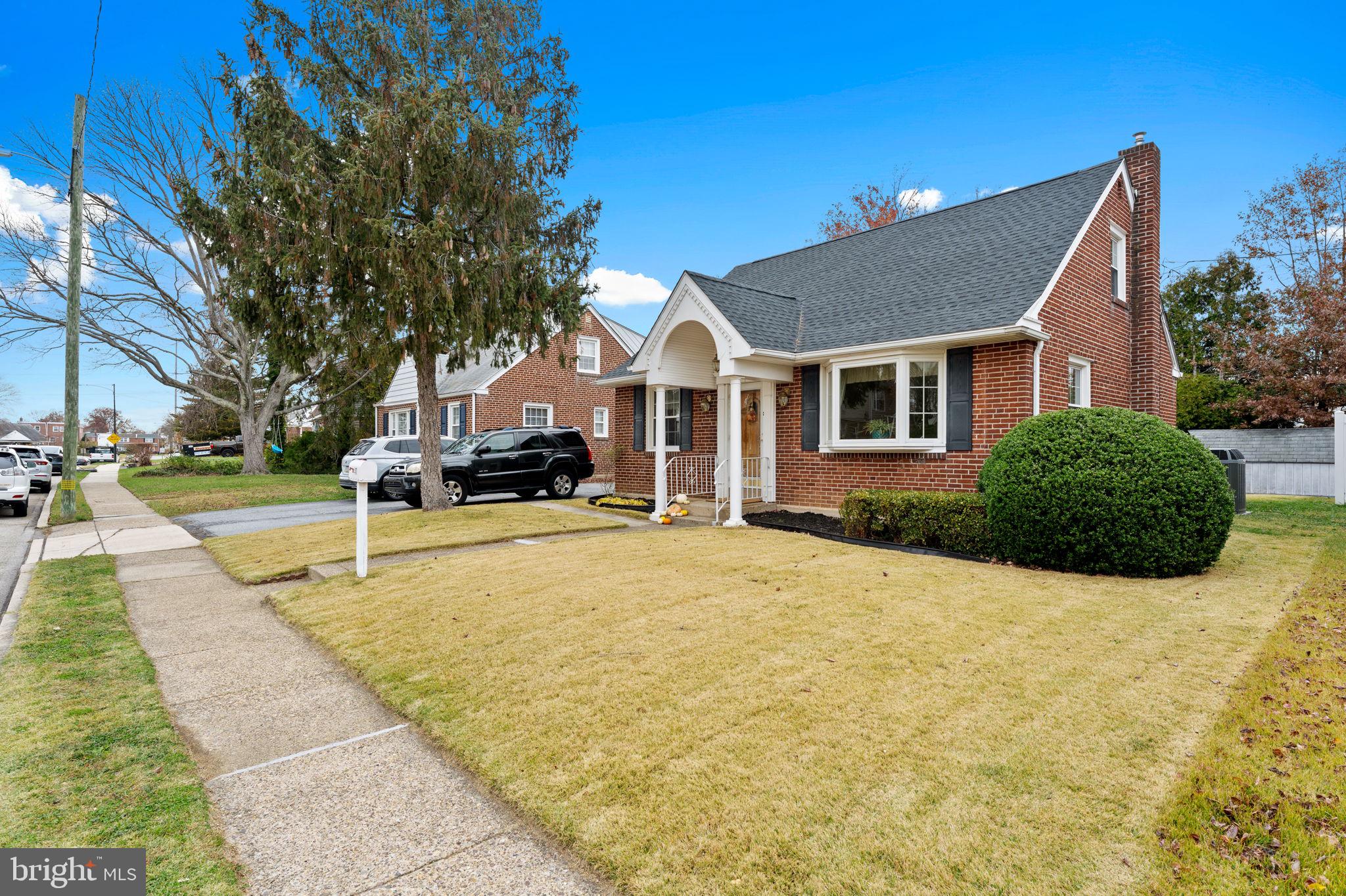 411 Buse Street Ridley Park, PA 19078 - Photo 2 of 30 a house that has a tree in front of it