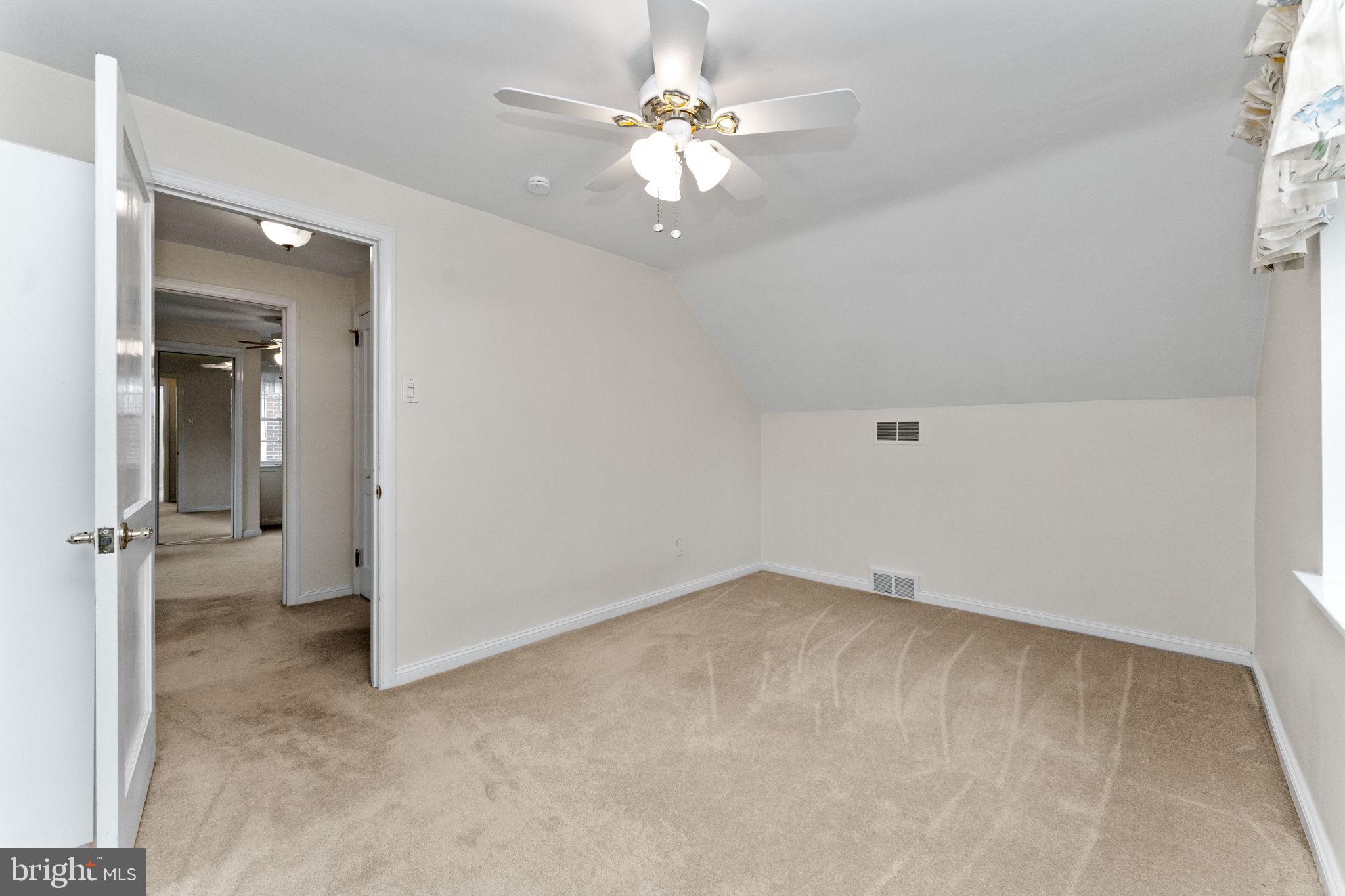 411 Buse Street Ridley Park, PA 19078 - Photo 21 of 30 wooden floor in an empty room with a window