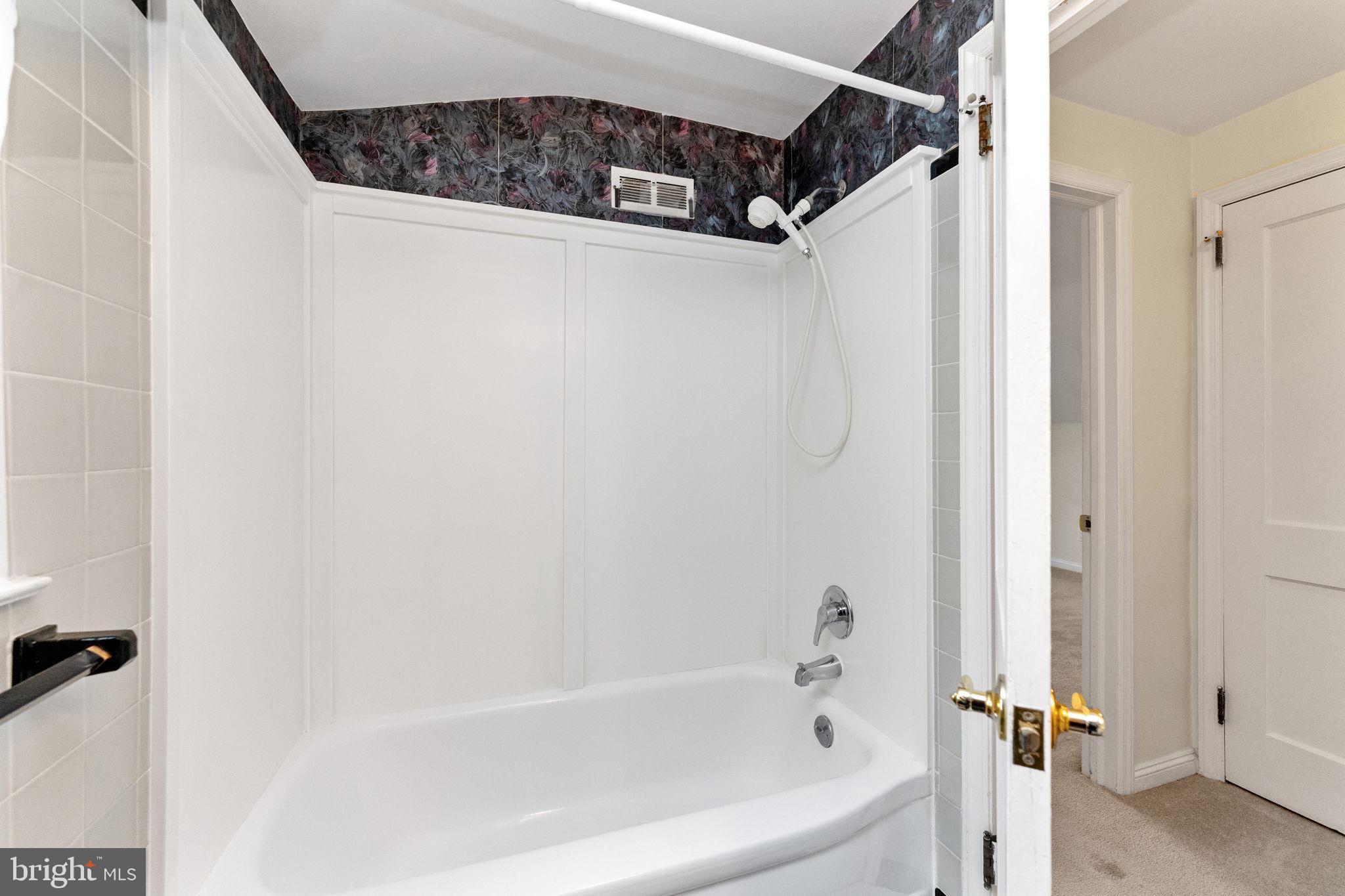 411 Buse Street Ridley Park, PA 19078 - Photo 23 of 30 a bathroom with a bathtub and a shower