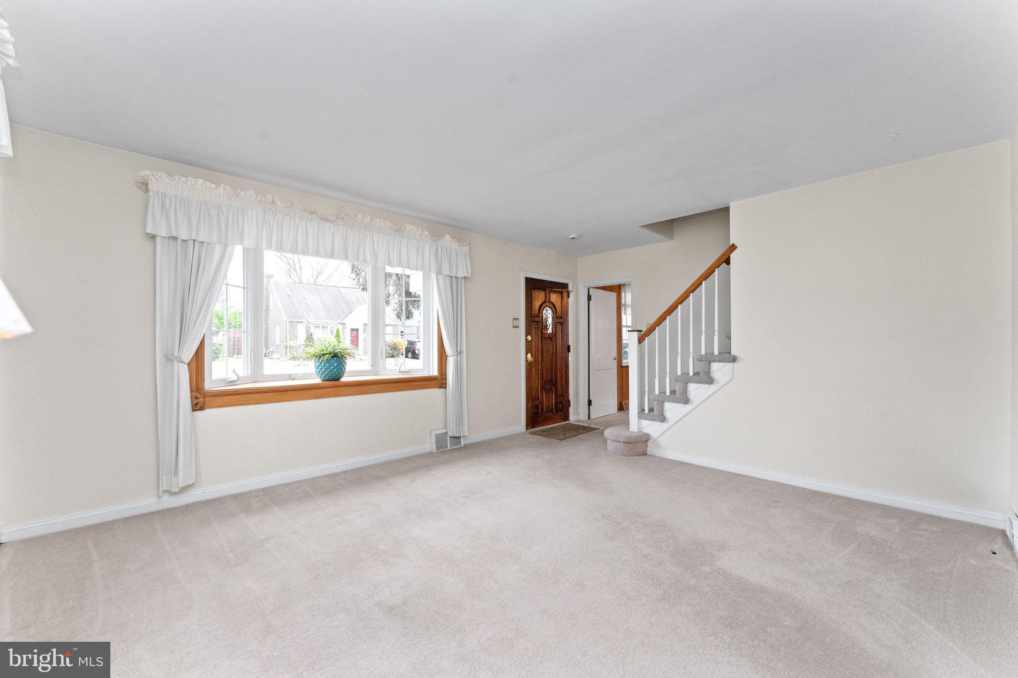 411 Buse Street Ridley Park, PA 19078 - Photo 5 of 30 a view of an empty room with a window