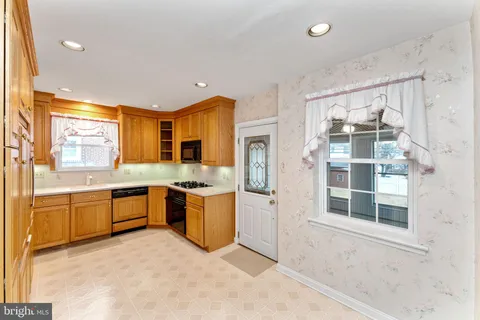 a large kitchen with a large window