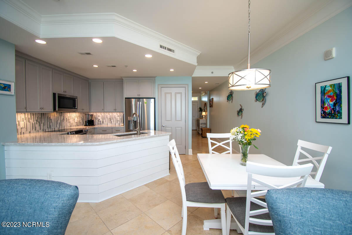 1435 Salter Path Road, Unit I 2 Indian Beach, NC 28512 - Photo 34 of 54 In 2022, cabinets were freshly painted and new LED under-cabinet lighting was added.