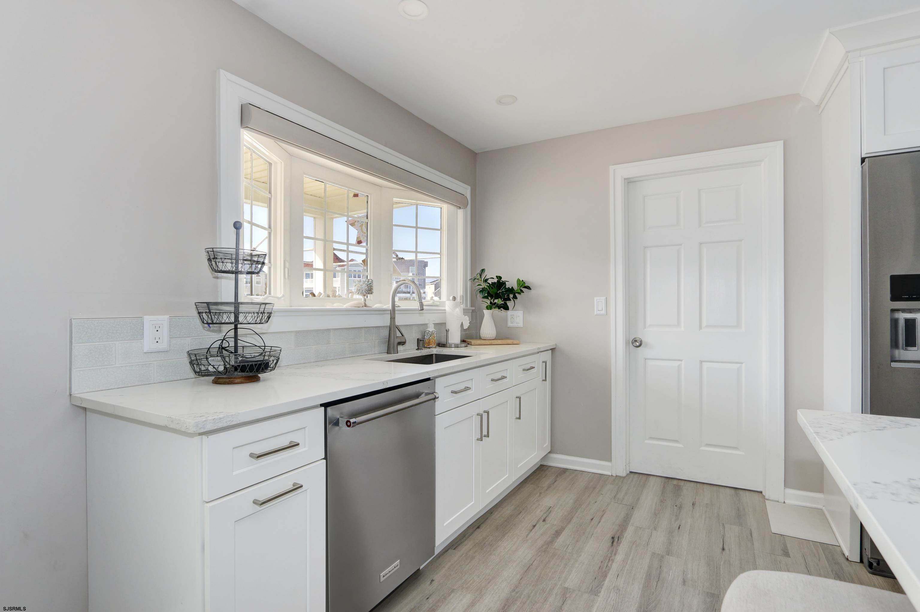 9 Sunset Boulevard Egg Harbor Township, NJ 08403 - Photo 14 of 60 a kitchen with a sink cabinets and window