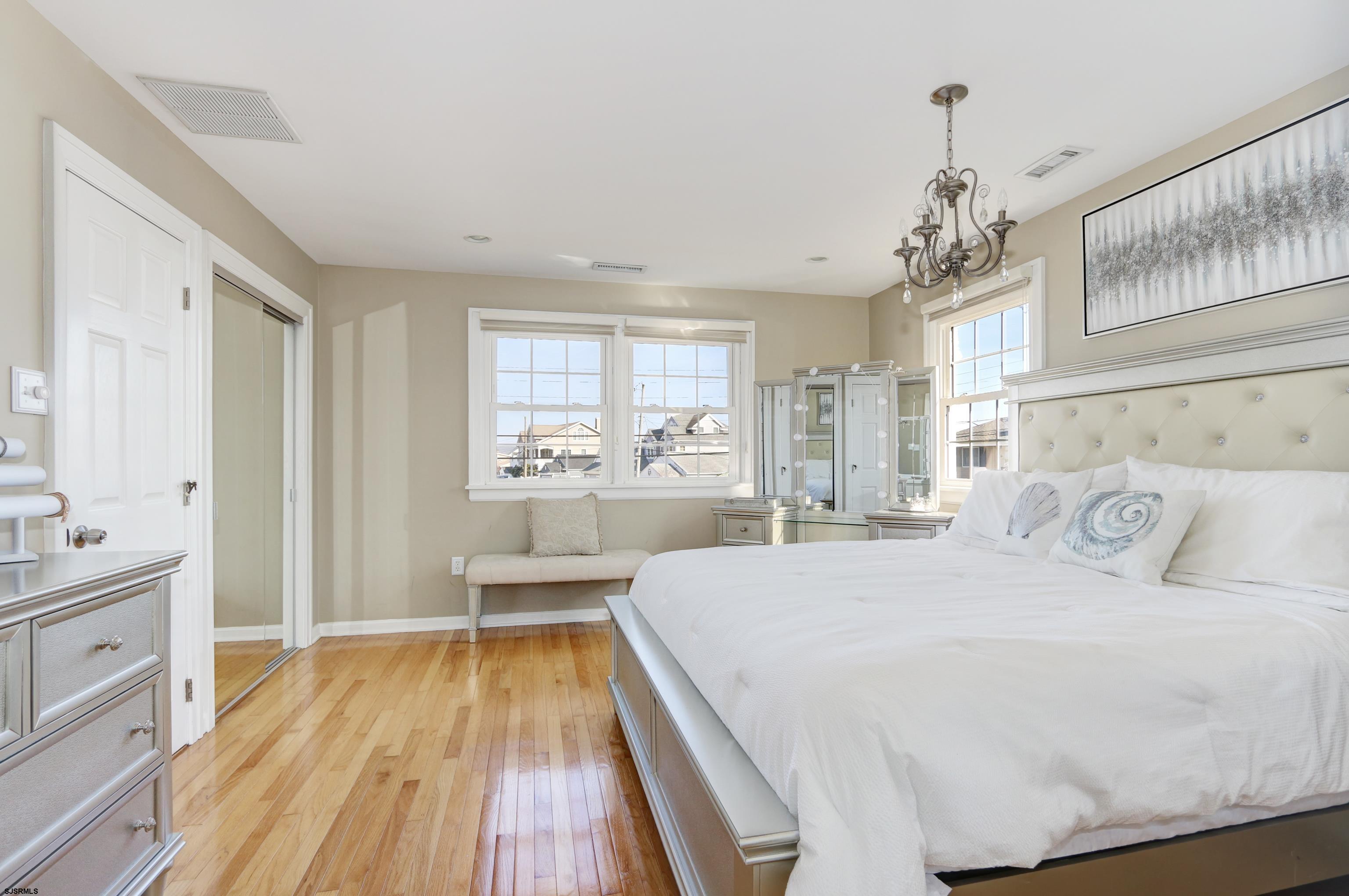 9 Sunset Boulevard Egg Harbor Township, NJ 08403 - Photo 16 of 60 a bedroom with a large bed and a window