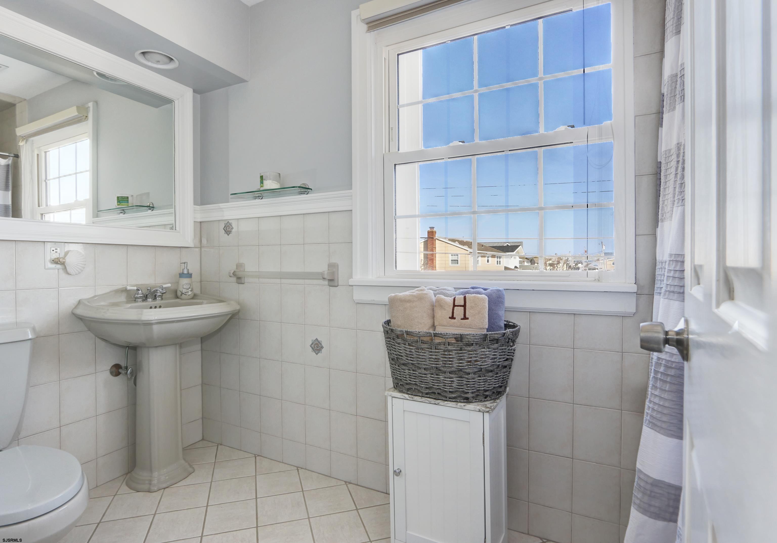 9 Sunset Boulevard Egg Harbor Township, NJ 08403 - Photo 18 of 60 a bathroom with a sink toilet and shower
