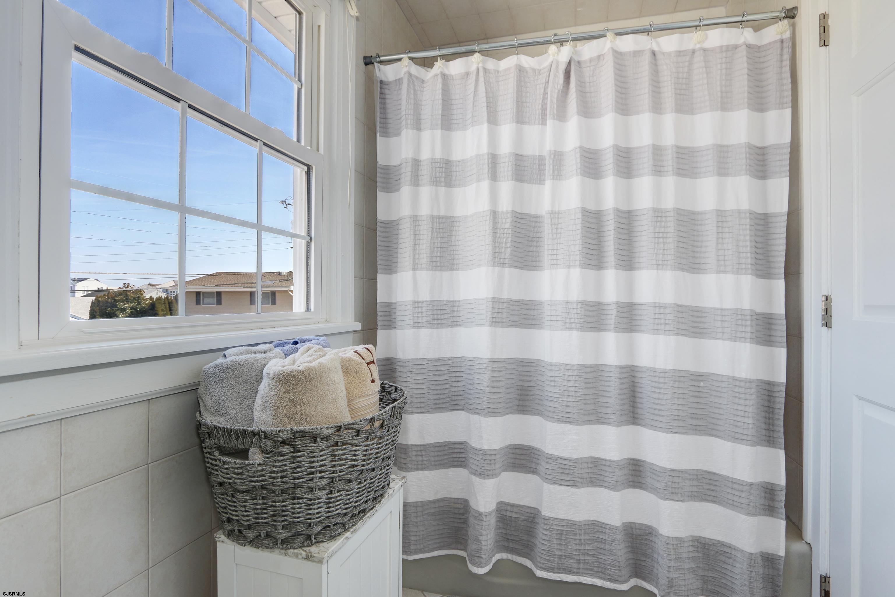 9 Sunset Boulevard Egg Harbor Township, NJ 08403 - Photo 19 of 60 a bathroom with a sink and a mirror