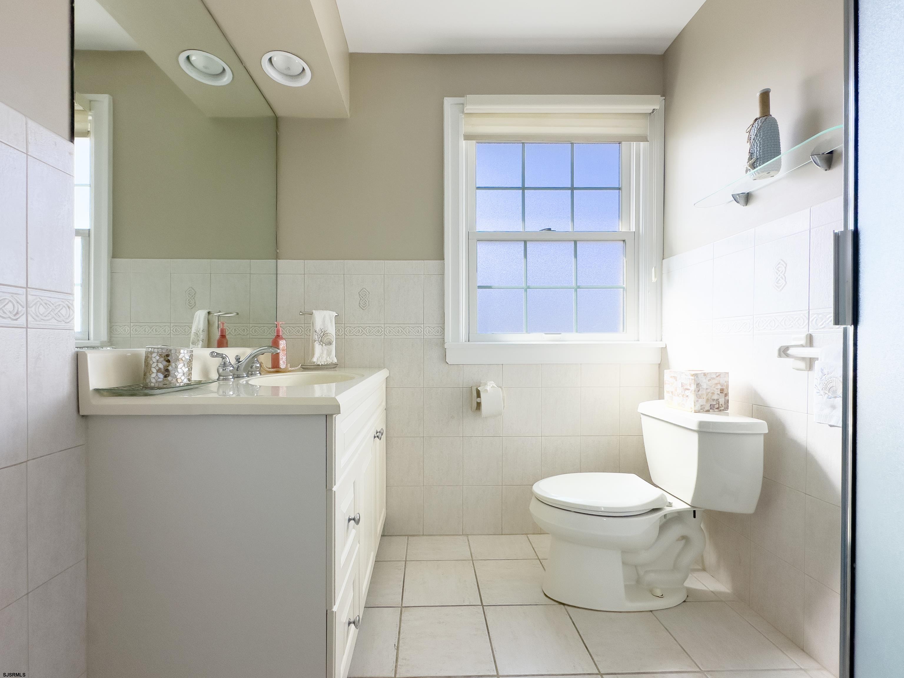 9 Sunset Boulevard Egg Harbor Township, NJ 08403 - Photo 22 of 60 a bathroom with a granite countertop sink a toilet and a shower