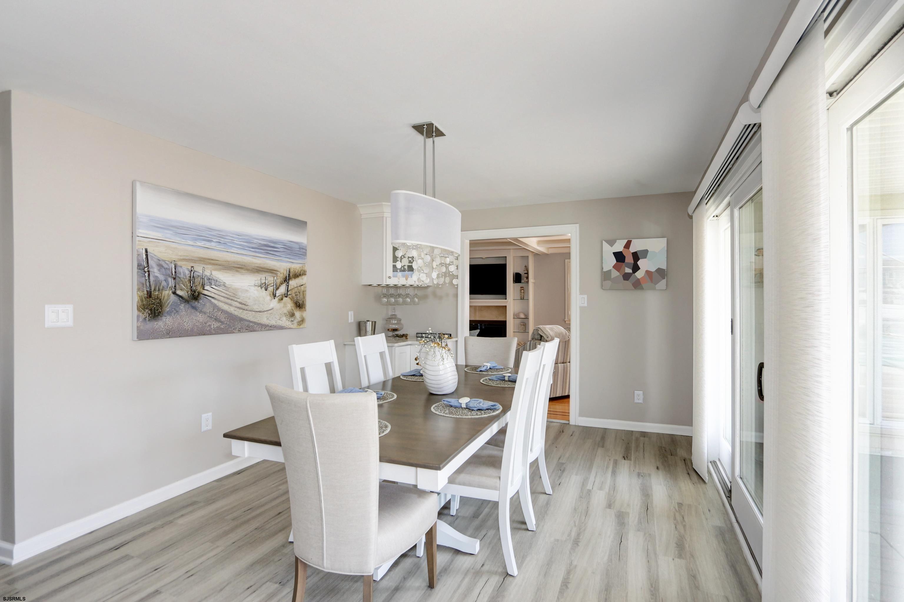9 Sunset Boulevard Egg Harbor Township, NJ 08403 - Photo 7 of 60 a view of a dining room with furniture window and wooden floor