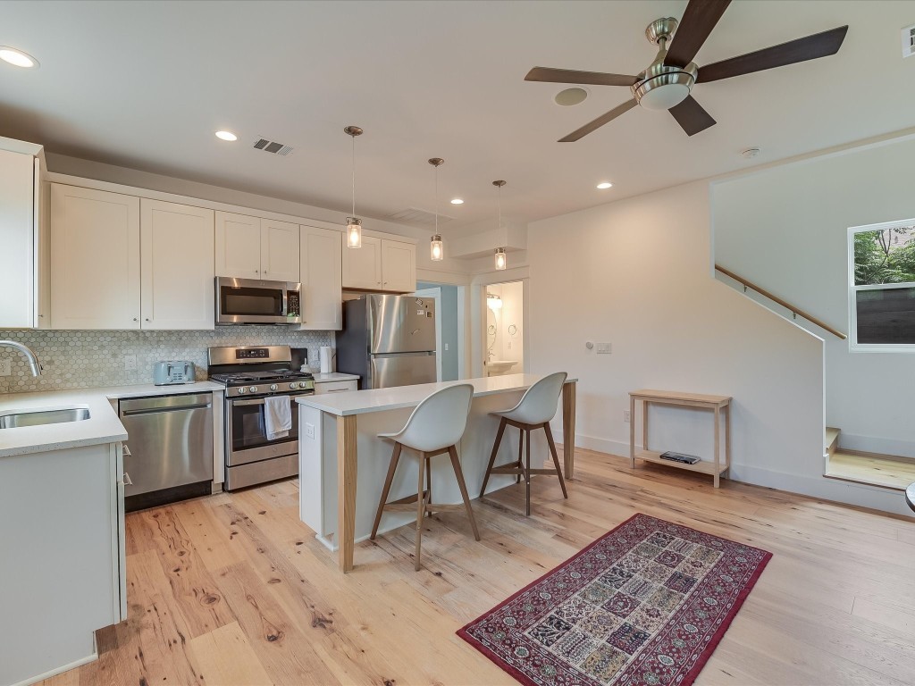 Modern, Clean and Turn-key home features wood floor throughout