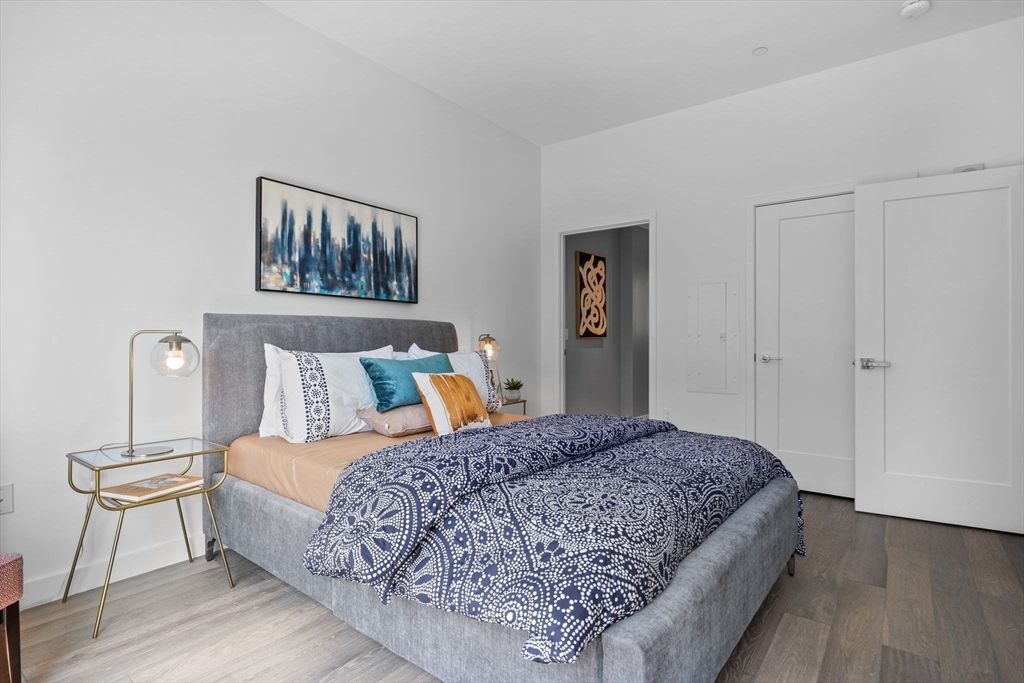 375 Canal Street, Unit PH101 Somerville, MA 02145 - Photo 15 of 39 a bedroom with a large bed and a window