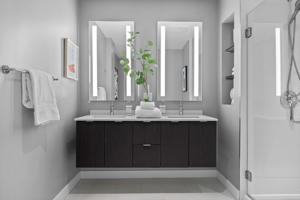 375 Canal Street, Unit PH101 Somerville, MA 02145 - Photo 17 of 39 a bathroom with a sink vanity and a mirror