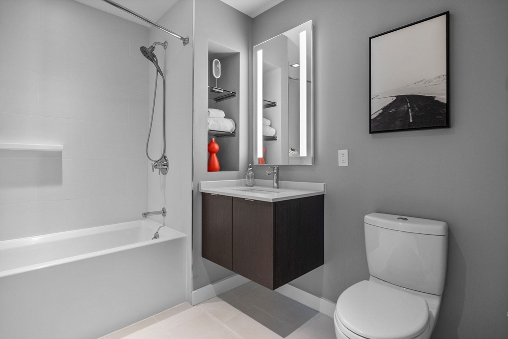 375 Canal Street, Unit PH101 Somerville, MA 02145 - Photo 20 of 39 a bathroom with a sink toilet and shower