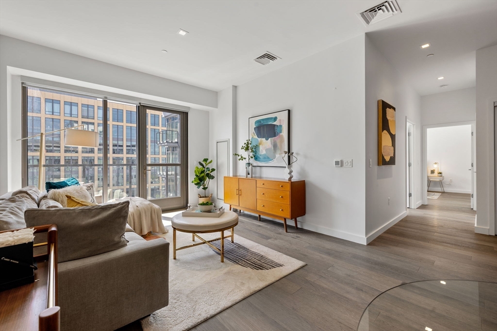 375 Canal Street, Unit PH101 Somerville, MA 02145 - Photo 2 of 39 a living room with furniture and a large window
