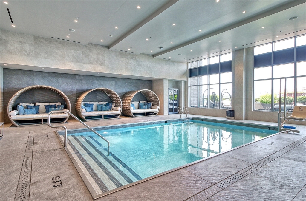 375 Canal Street, Unit PH101 Somerville, MA 02145 - Photo 25 of 39 a view of a swimming pool and a large window