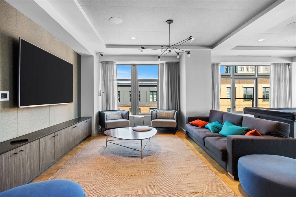 375 Canal Street, Unit PH101 Somerville, MA 02145 - Photo 28 of 39 a living room with furniture and a flat screen tv