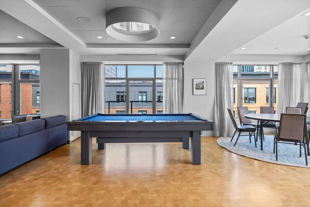 375 Canal Street, Unit PH101 Somerville, MA 02145 - Photo 30 of 39 a room with furniture pool table and windows