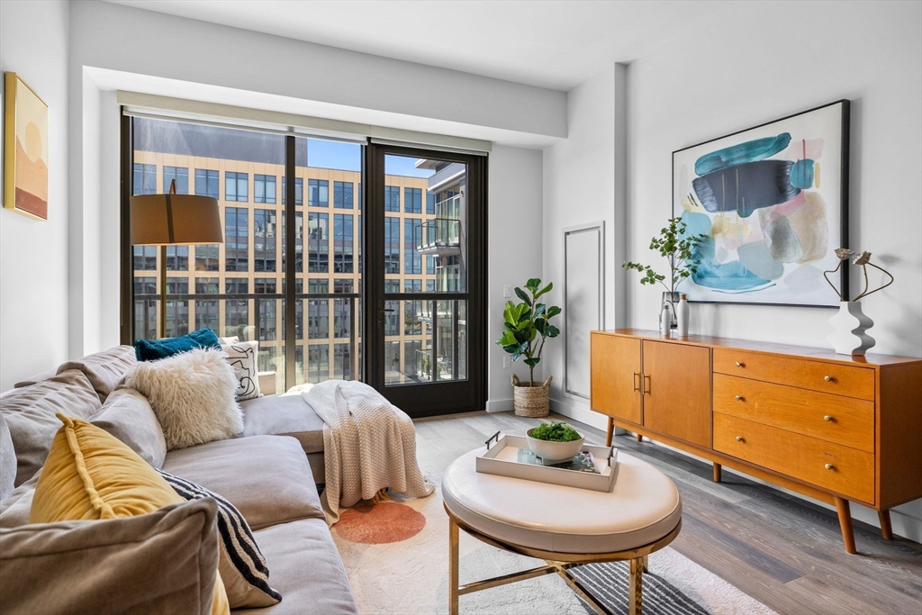 375 Canal Street, Unit PH101 Somerville, MA 02145 - Photo 4 of 39 a living room with furniture and a potted plant