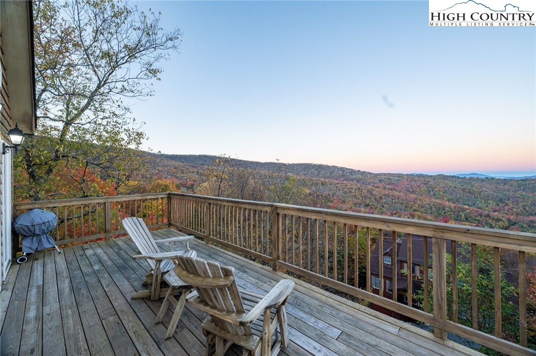 309 Pinnacle Ridge Road Beech Mountain, NC 28604 - Photo 6 of 45 a view of a balcony with mountain view and wooden floor