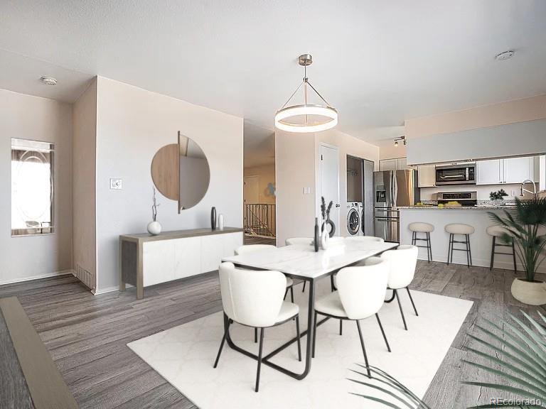a view of a dining room with furniture window and wooden floor