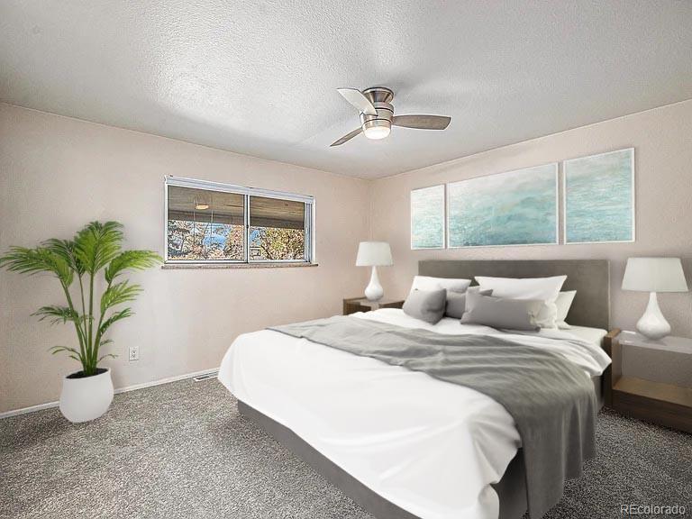 1830 Simms Street Lakewood, CO 80215 - Photo 14 of 31 a bedroom with a large bed and a potted plant