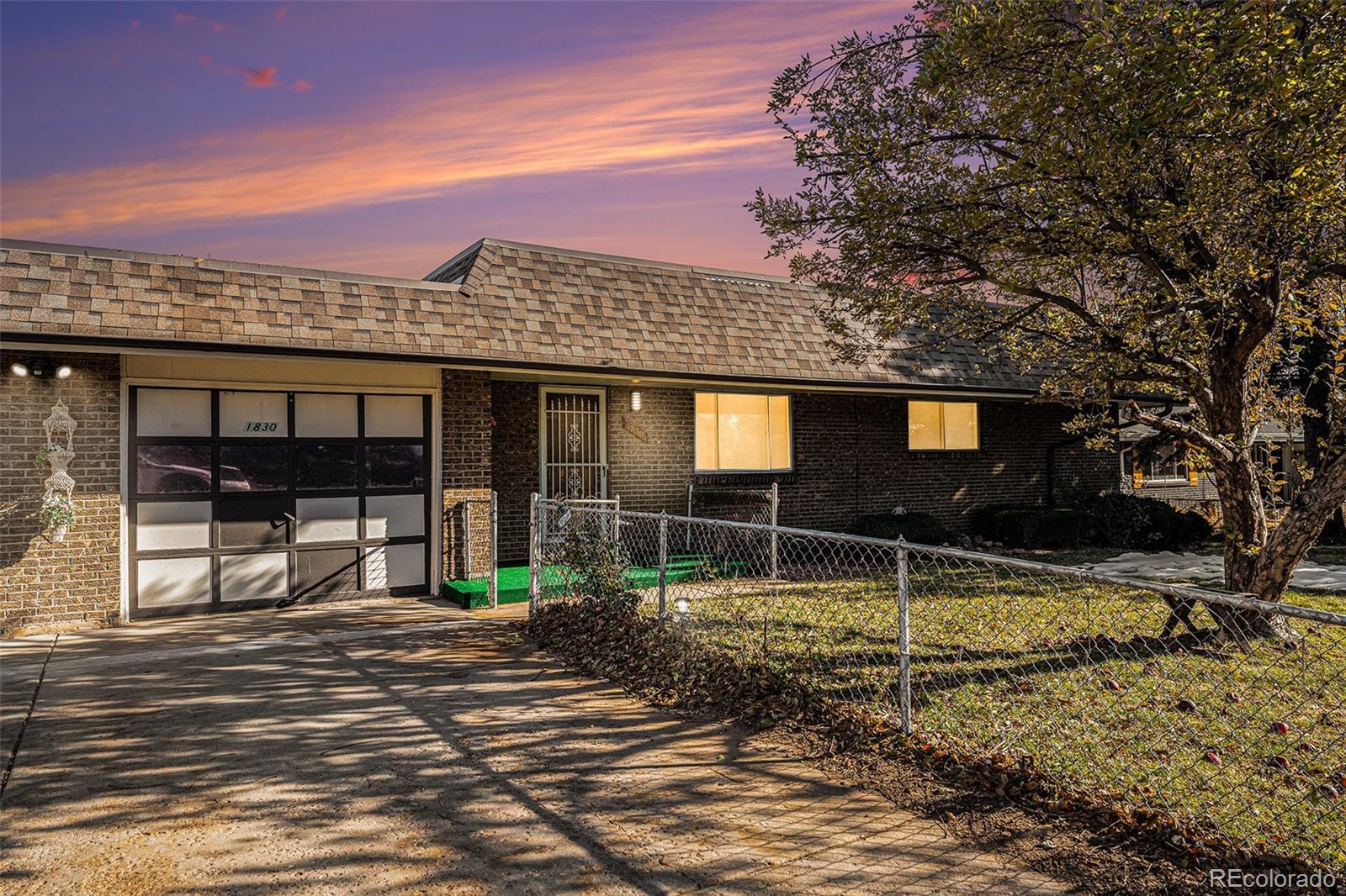1830 Simms Street Lakewood, CO 80215 - Photo 2 of 31 a front view of a house with a yard balcony