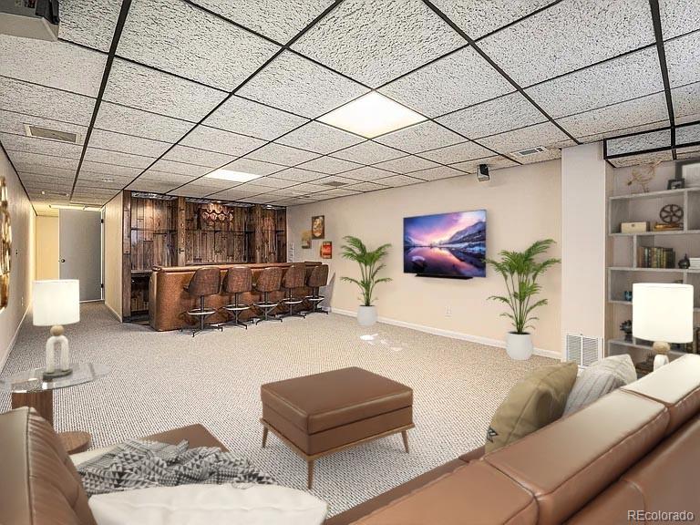 1830 Simms Street Lakewood, CO 80215 - Photo 25 of 31 a living room with furniture and a flat screen tv