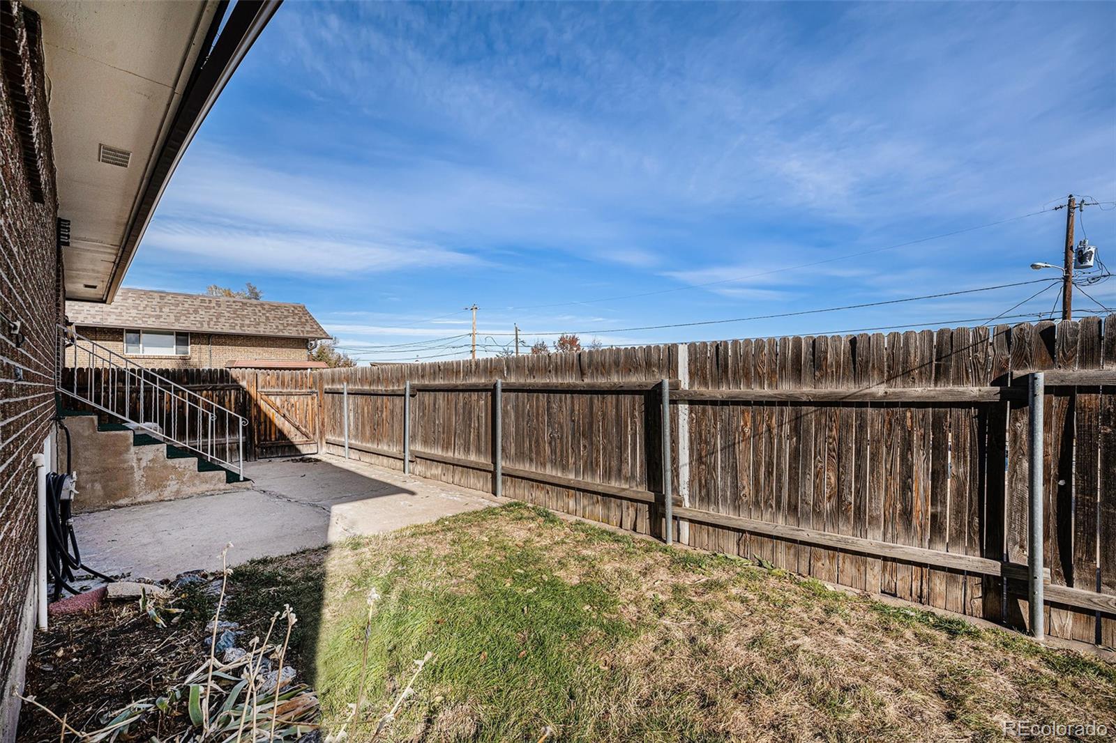 1830 Simms Street Lakewood, CO 80215 - Photo 26 of 31 a view of balcony with wooden floor and fence