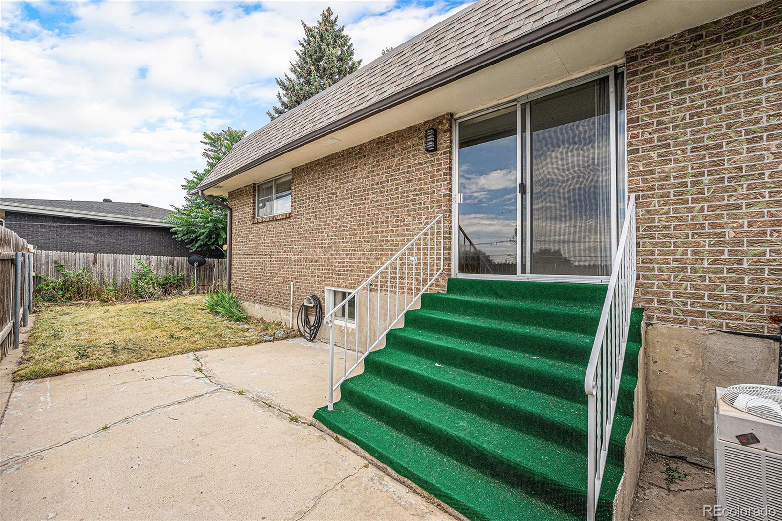 1830 Simms Street Lakewood, CO 80215 - Photo 28 of 31 a view of a house with a yard