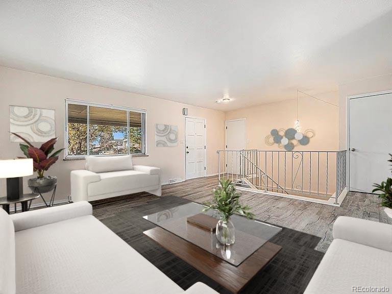 1830 Simms Street Lakewood, CO 80215 - Photo 4 of 31 a living room with furniture and a potted plant