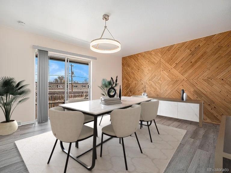 1830 Simms Street Lakewood, CO 80215 - Photo 8 of 31 a view of a dining room with furniture and wooden floor